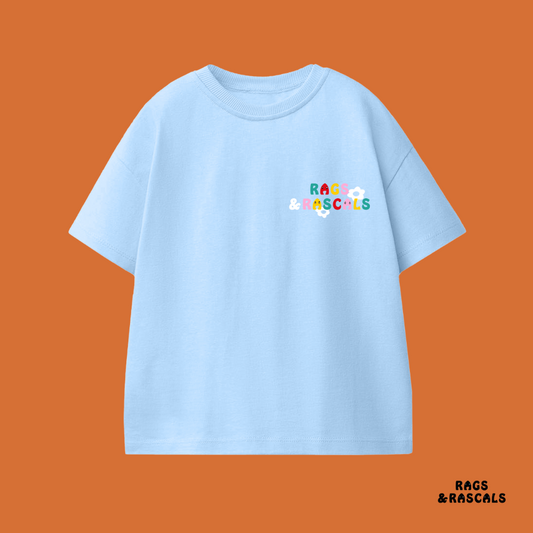 Light blue t-shirt with colorful text,  featuring a children's brand called "Rags and Rascals".