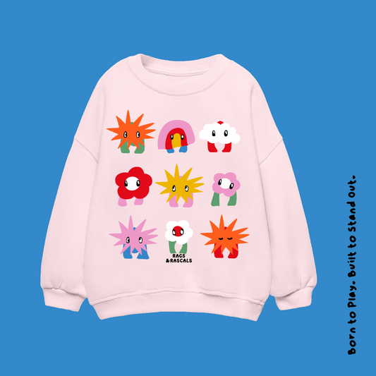 Pink sweatshirt with colorful cartoon Rags & Rascals characters. 