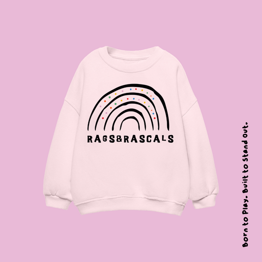 light pink sweatshirt with rainbow design and 'Rags & Rascals' branding.