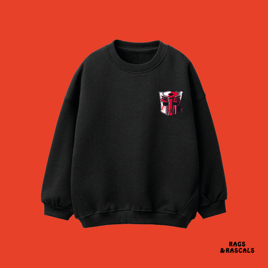 Black Transformers sweatshirt with a red and white logo,  from a children's brand called 'Rags & Rascals'.