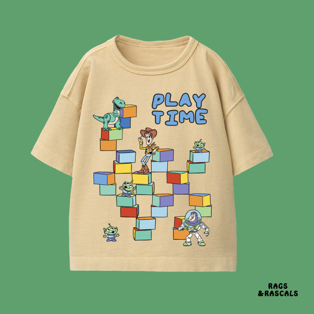 Beige t-shirt with cartoon characters and 'Play Time' text,  from a children's brand called  "Rags and Rascals".