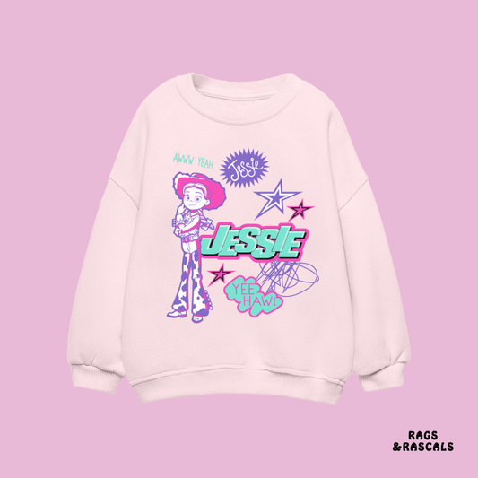 White sweatshirt with Jessie from Toy Story design,  from a brand called "Rags and Rascals". 